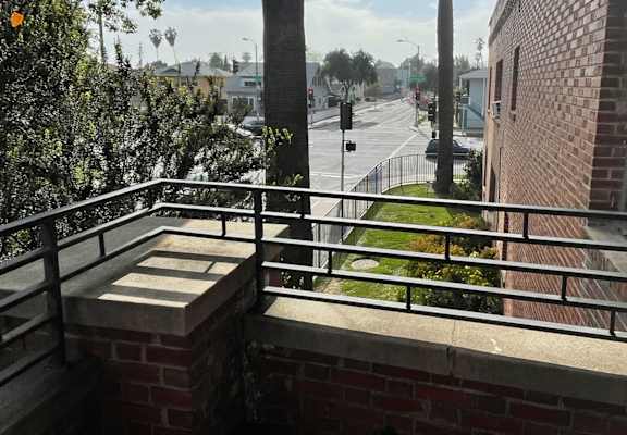 a view of the street from a balcony