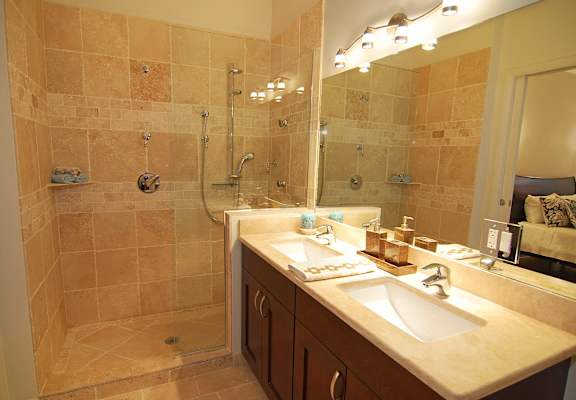Contemporary bathroom at Highpoint Jefferson Park apartments in Chicago with walk-in shower and sleek tile finishes