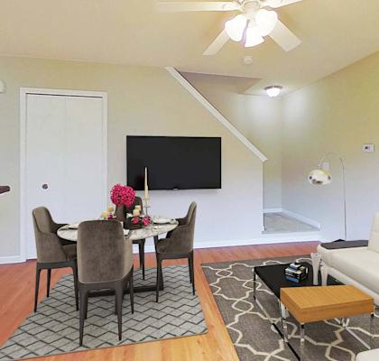 a living room and dining room with a couch and a table