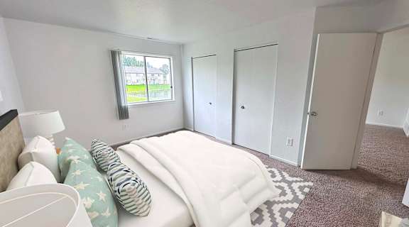 a bedroom with a bed and a closet