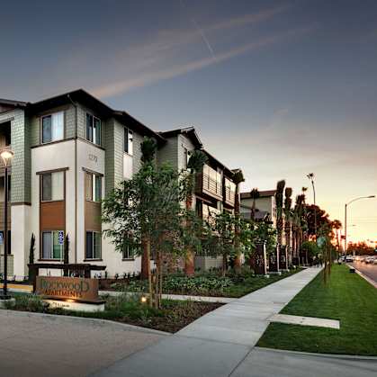 Apartment complex with a street in front.