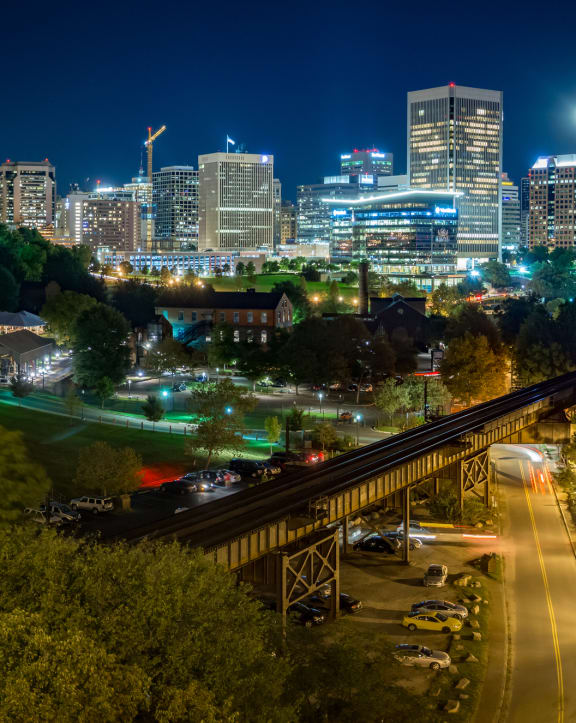 a cityscape at night with a full moon at The Bella at Westchester, Midlothian, 23113
