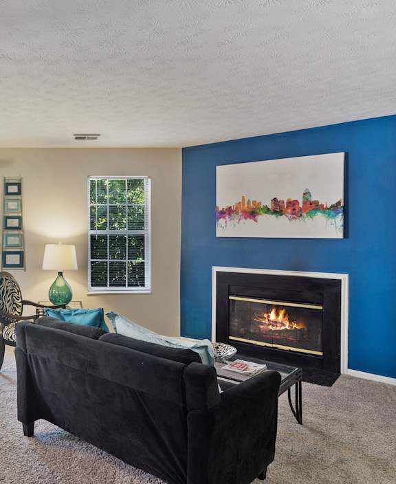 A living room with a fireplace and a couch.