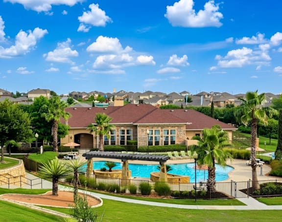 A large house with a pool in the backyard.