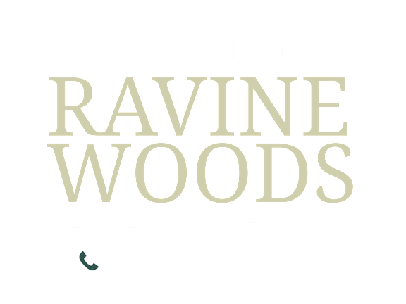 A black background with yellow text welcoming people to Ravine Woods Apartments.