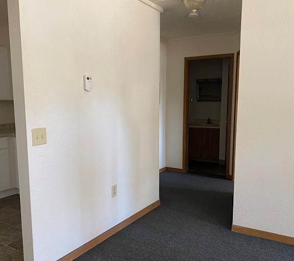 a living room with a couch and a table and a television