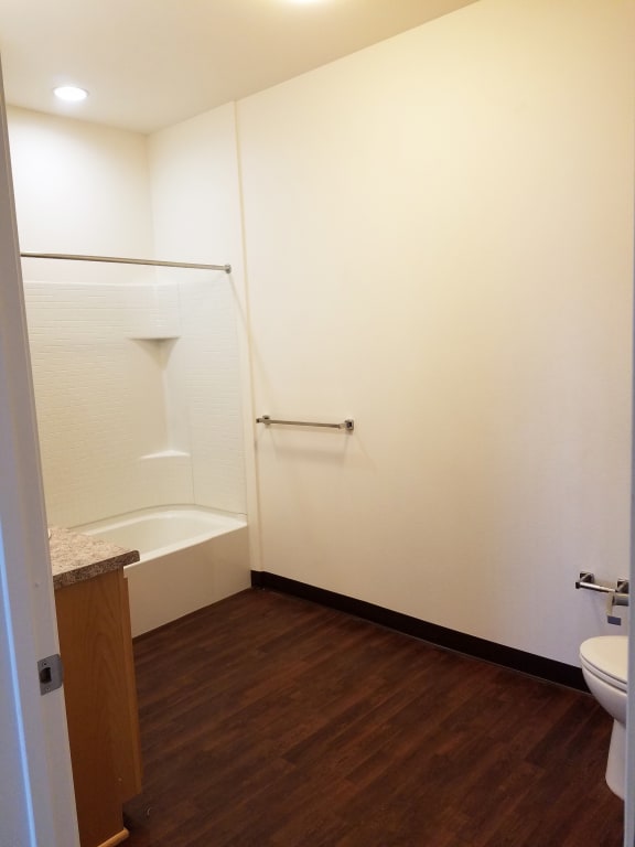 Image of a sink, a bathtub, a toilet, and a towel rack