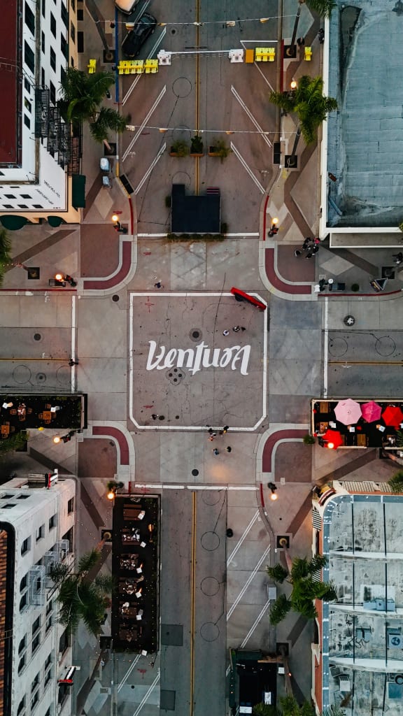 an aerial view of a parking lot in the city