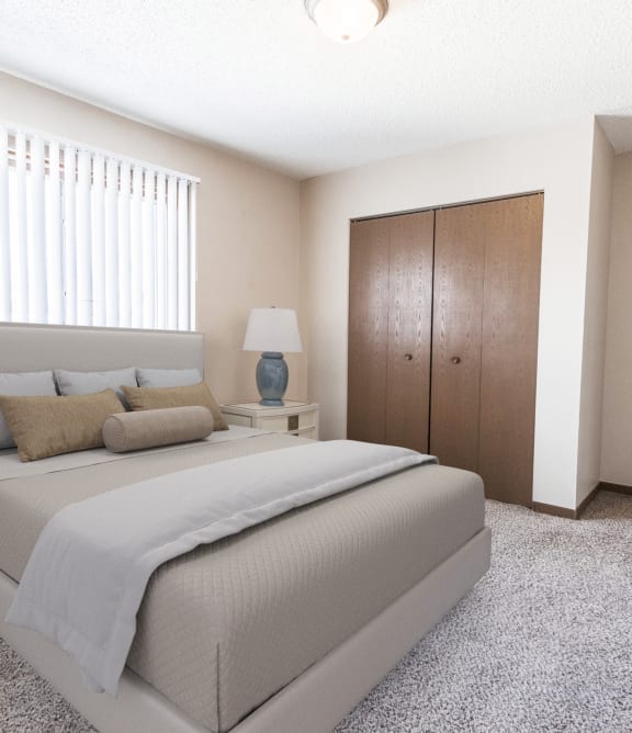 the preserve at ballantyne commons bedroom with bed and closet