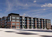 Thumbnail 8 of 8 - A modern apartment complex with a mix of brick and panel buildings.