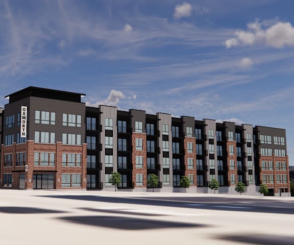 A modern apartment complex with a mix of brick and panel buildings.