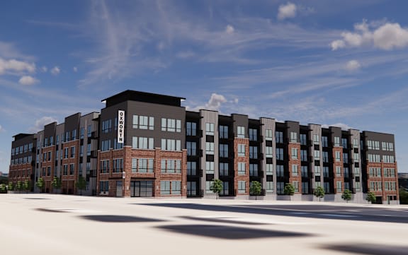 A modern apartment complex with a mix of brick and panel buildings.