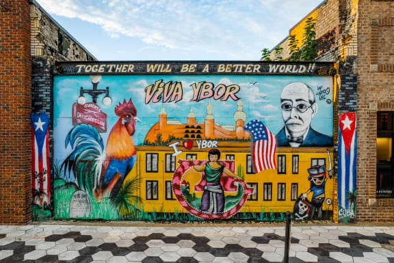 a mural on the side of a building that says together will be a better world at Casa Marti, Tampa, 33605