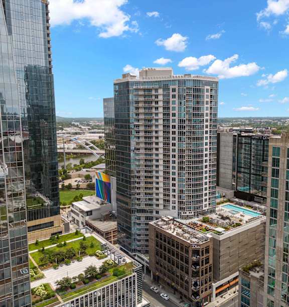 A cityscape with tall buildings and a clear sky.