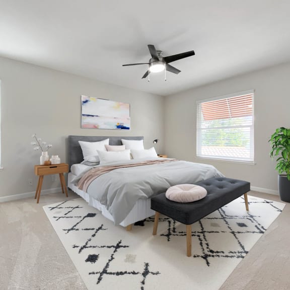a bedroom with a bed and a ceiling fan at Valley Plaza Villages, Pleasanton, 94566