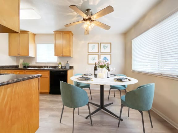 A kitchen with a table set for four. at Pleasanton Place, Pleasanton, California