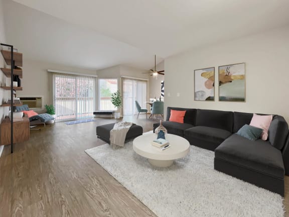 a living room with a black couch and a white rug at Valley Plaza Villages, Pleasanton, 94566