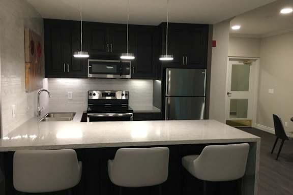 a view of a kitchen with a marble counter top
