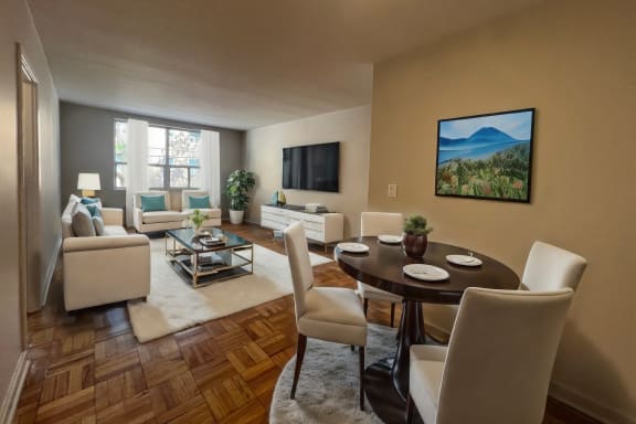 a living room with a table and chairs and a couch