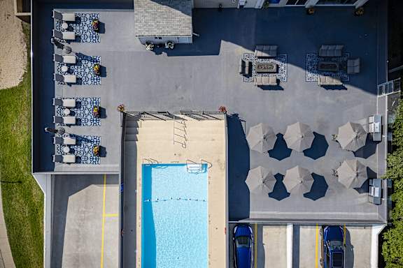 arial view of a swimming pool on the roof of a building