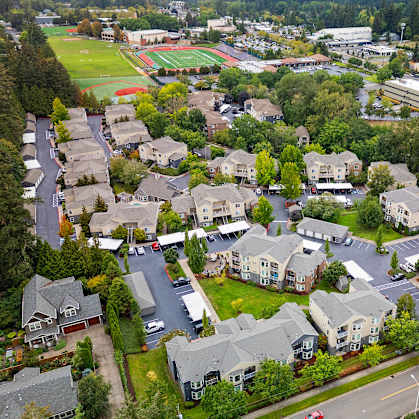 an aerial view of a neighborhood with houses and trees