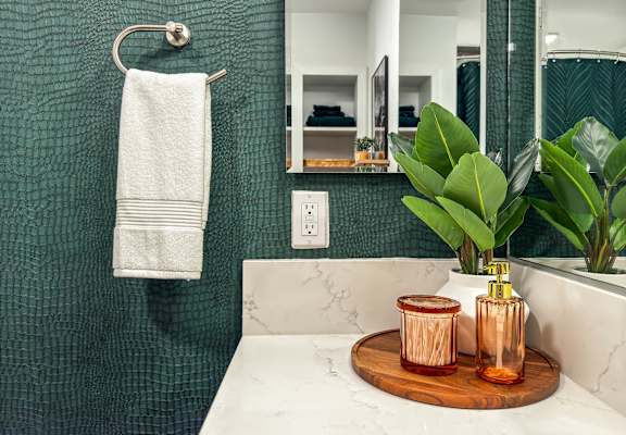 Bathroom with towel hanging on a hook at AMP 30 Apartments, San Diego, CA, 92116