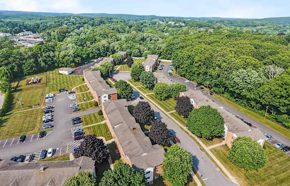 an aerial view of a neighborhood with houses and parking lot at Rose Hill Estates, Norwich, CT