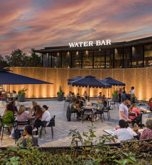 people sitting at the tables on a terrace at The Bartlett in Arlington, VA 22202