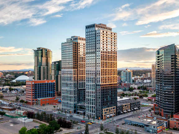 A cityscape with tall buildings and a clear sky.