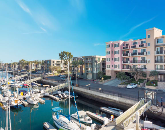 a view of a marina with boats and buildings at Marina Harbor, California, 90292