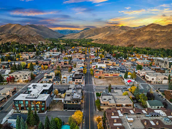 A small town with a mountain range in the background at The Woods at Copper Ranch, Hailey, Idaho