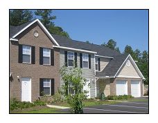 a house with two garages in front of it