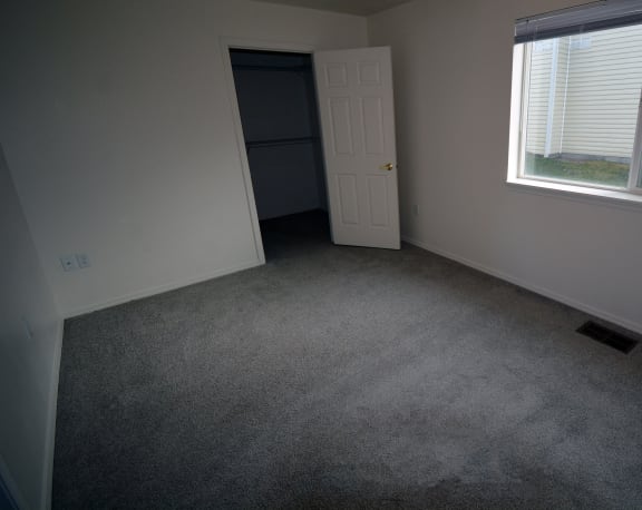 Image of room with close and window