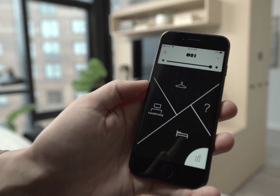 a hand holding a cell phone with a navigation screen on it