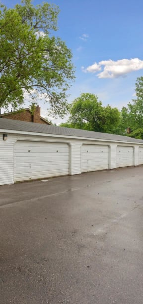 A row of white garage doors are closed. at Silver Lake, New Brighton, 55112