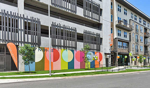a mural on the side of a building on a city street