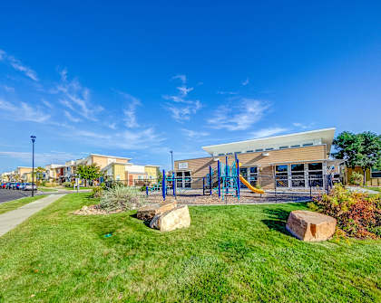 the preserve at ballantyne commons park with playground and green grass