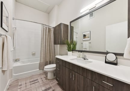 Spacious Bathroom with White Quartz Counters and Framed Mirror in Austin, Texas