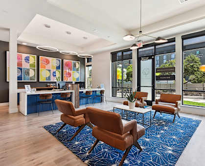 the preserve at cardinalioch apartments lobby area with seating and large windows