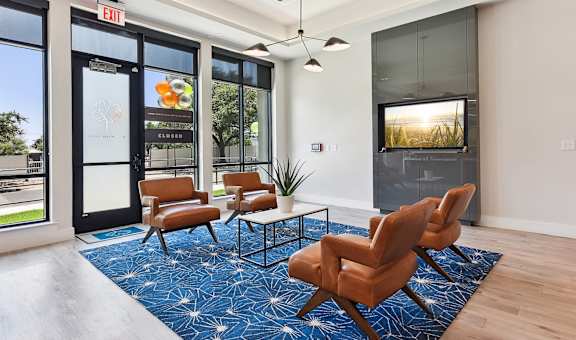 the preserve at ballantyne commons community living room with couches and a tv
