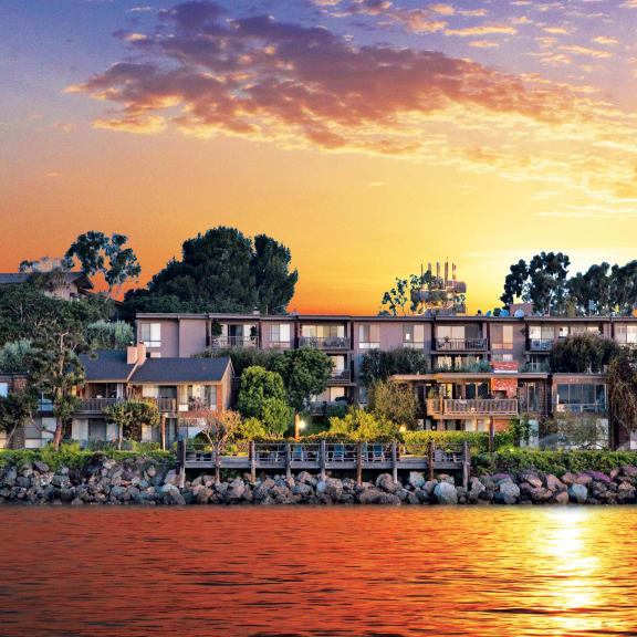 a group of houses on the water at sunset  at Mariners Village, Marina del Rey, California