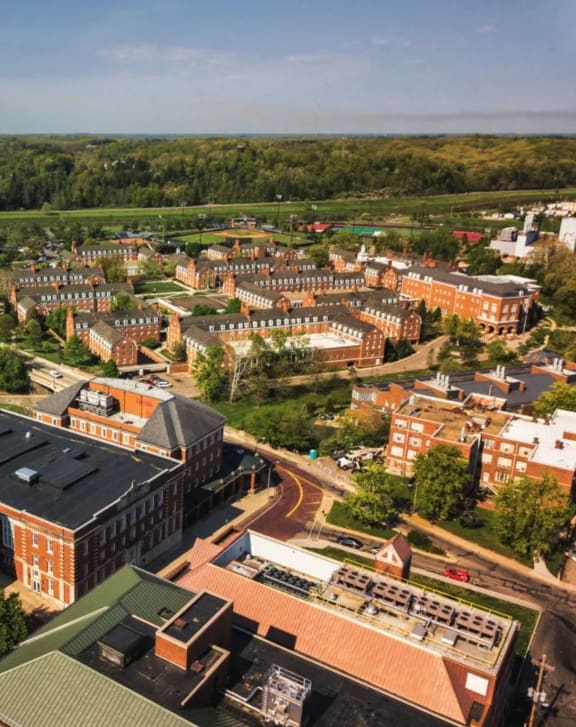 an aerial view of a city with buildings and trees