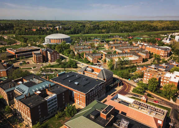 an aerial view of a city with buildings and trees