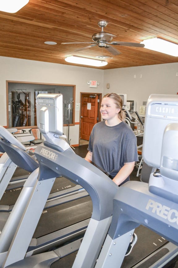 a woman walking on a treadmill in a gym at Boulder Ridge, Minnesota, 55811