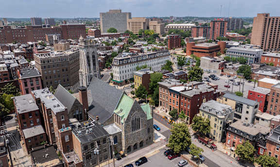 A cityscape with a mix of old and new buildings.