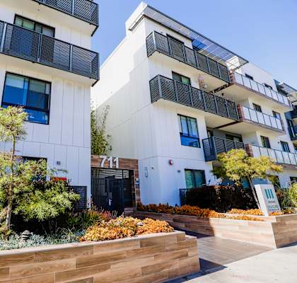 an image of the front of a building on a sunny day