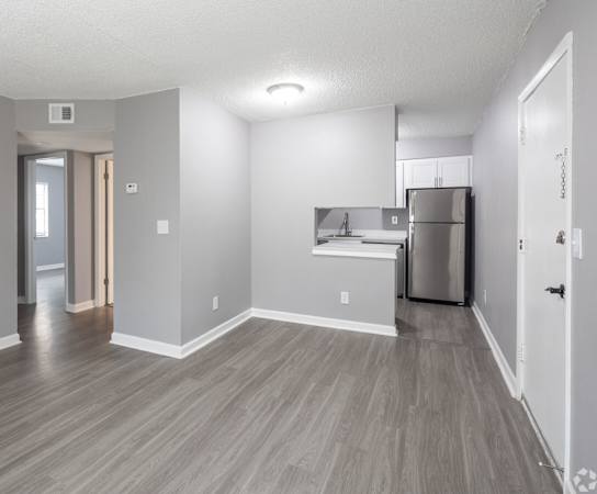 Renovated Apartment Home Living and Kitchen at Fernwood Grove Apartments, Tampa, FL