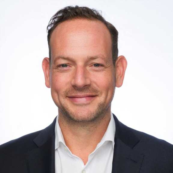 a man wearing a suit and a white shirt and a black