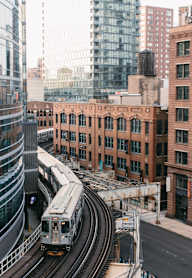 a train on a track in a city