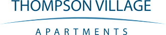A black and white image of a sign for Thompson Village Apartments.